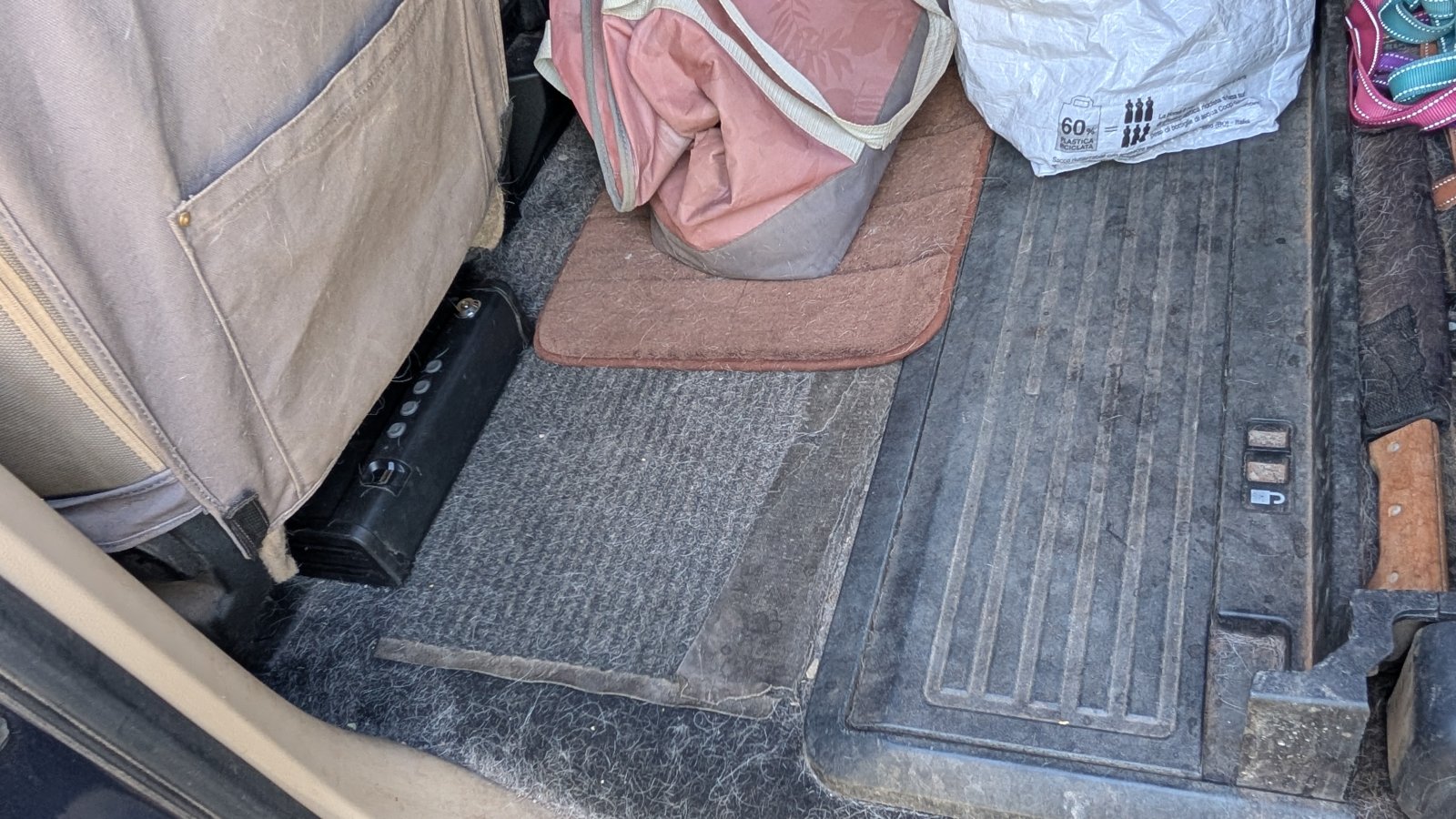 Compact vehicle safe stashed out of sight behind the front row seats of a crew-cab truck